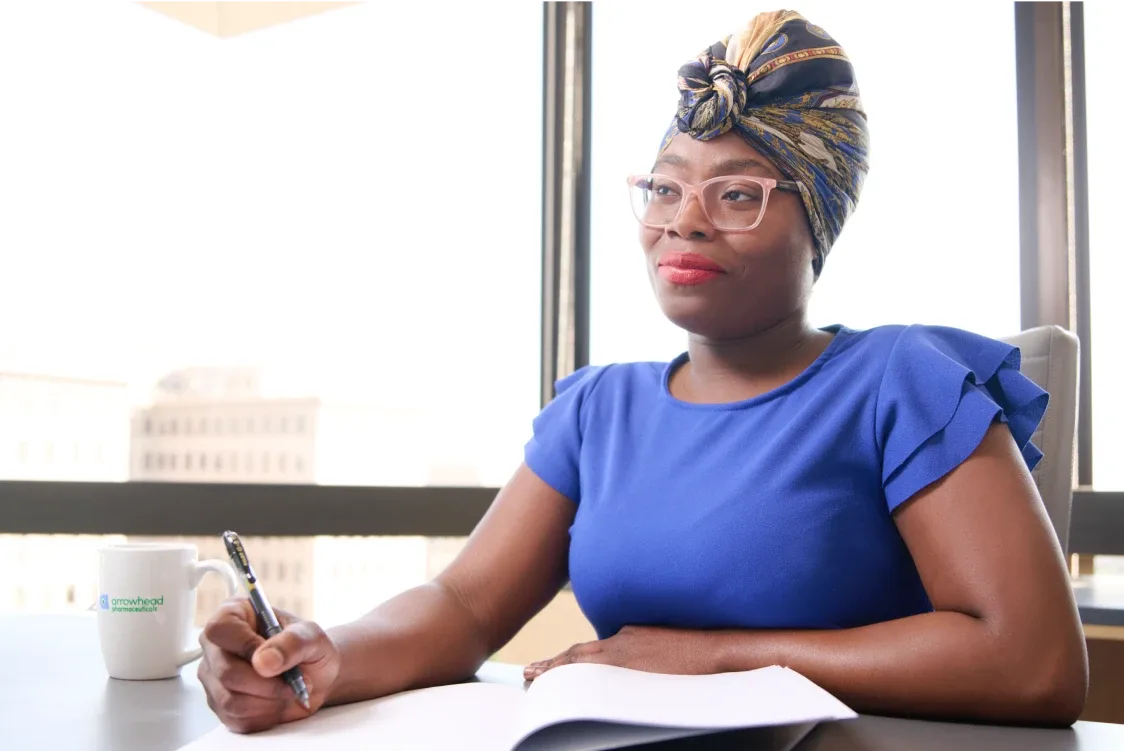 Woman taking notes in a meeting