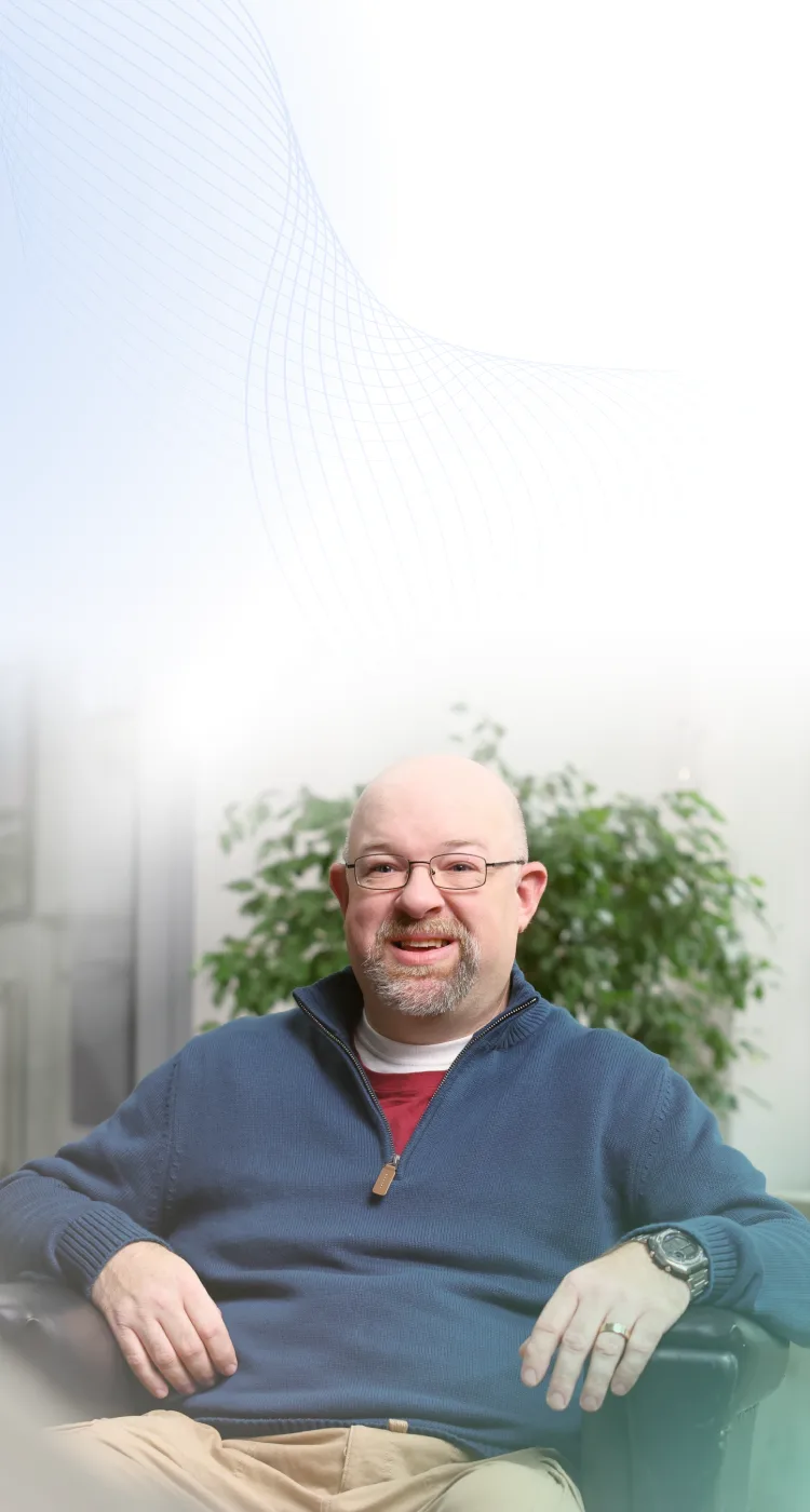 Man sitting in chair smiling