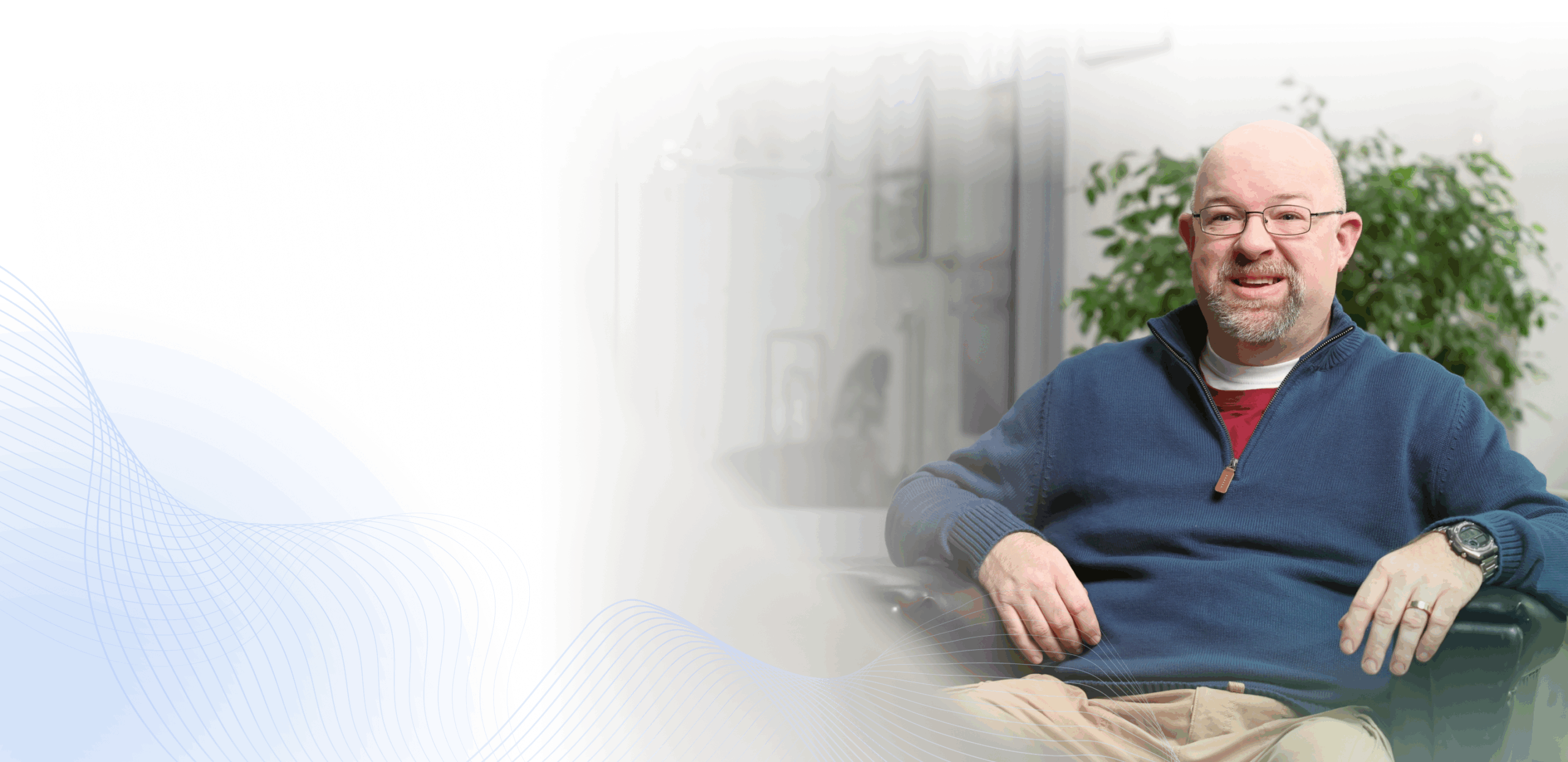 Man sitting in chair smiling